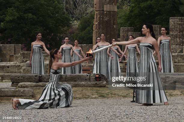 Greek actress Mary Mina , playing the role of the High Priestess, lights the torch during the flame lighting ceremony for the Paris 2024 Summer...