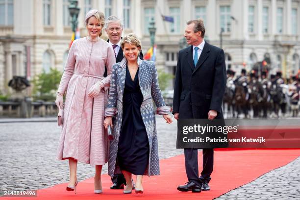 King Philippe of Belgium and Queen Mathilde of Belgium welcome Grand Duke Henri of Luxembourg and Grand Duchess Maria Teresa of Luxembourg during an...