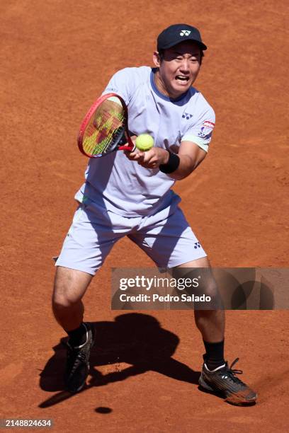 Yoshihito Nishioka of Japan in action against Jaume Munar of Spain during Second Round of Barcelona Open Banc Sabadell 2024 at Real Club De Tenis...
