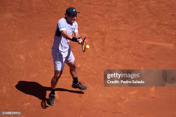 Yoshihito Nishioka of Japan in action against Jaume Munar of Spain during Second Round of Barcelona Open Banc Sabadell 2024 at Real Club De Tenis...