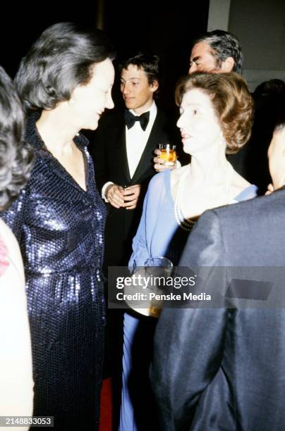Janet Lee Auchincloss and guest attend the party honoring Kennedy Center Chairman Roger Stevens on January 25, 1976 in Washington, D.C.