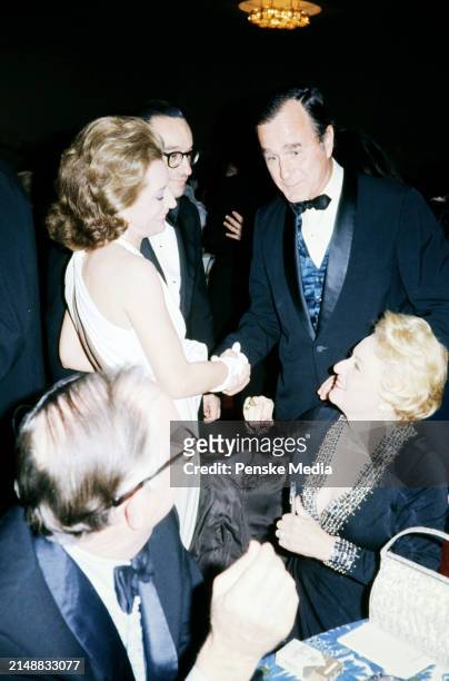 Broadcast journalist Barbara Walters , politician George H. W. Bush, and guests attend the party honoring Kennedy Center Chairman Roger Stevens on...