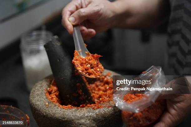 mortar chilli sauce spice mixture chili paste - chili sauce stock pictures, royalty-free photos & images