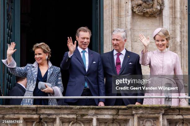 Grand Duchesse Maria Teresa and Grand Duke Henri of Luxembourg together with King Philippe and Queen Mathilde of Belgium stand on the balcony of the...