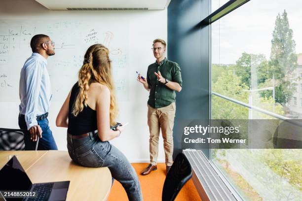 dynamic whiteboard strategy session - project execution stock pictures, royalty-free photos & images