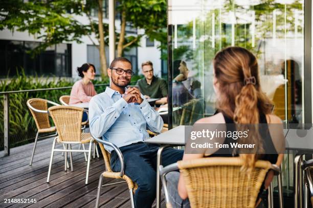 outdoor business meeting in progress - work lunch break stock pictures, royalty-free photos & images
