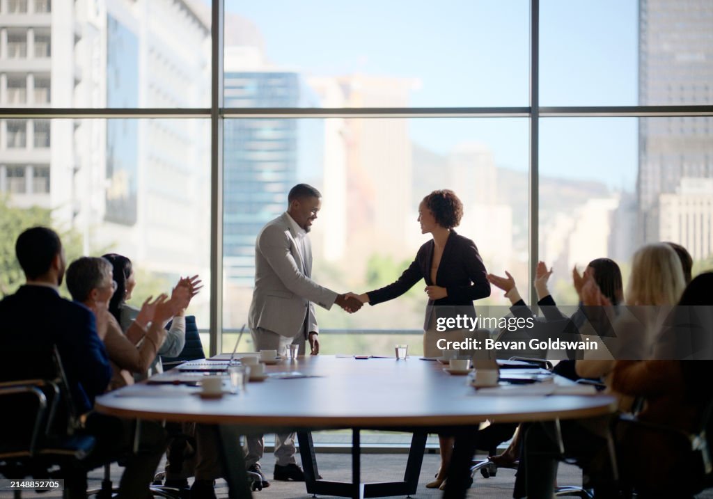 Meeting, handshake and business people in office for interview, welcome applause or onboarding for collaboration. Men, women and shaking hands in conference room for agreement, consulting or b2b deal