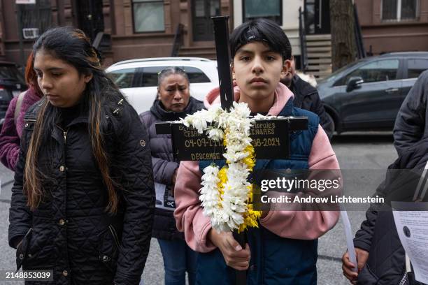 Family and friends of Cezar Morales Linares, a bicycle delivery worker from Xalpatiahuac, Guerrero, Mexico, hold a vigil for him at the site where he...