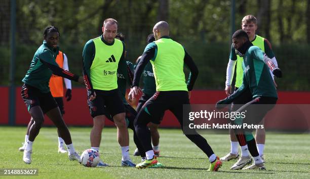 Habeeb Ogunneye, Christian Eriksen, Marcus Rashford of Manchester United in action during a first team training session at Carrington Training Ground...