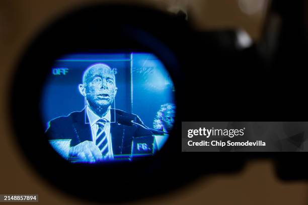 Homeland Security Secretary Alejandro Mayorkas is seen through a television camera viewfinder as he testifies before the House Homeland Security...