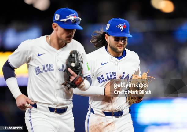 Cavan Biggio and Bo Bichette of the Toronto Blue Jays run off the field against the New York Yankees during the sixth inning in their MLB game at the...