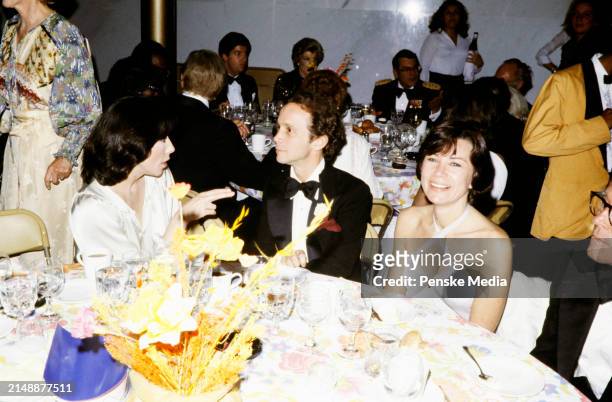 Actress Lily Tomlin, actor Joel Grey, and actress Jo Wilder attend the American Film Institute 10th Anniversary Gala on November 17, 1977 in...
