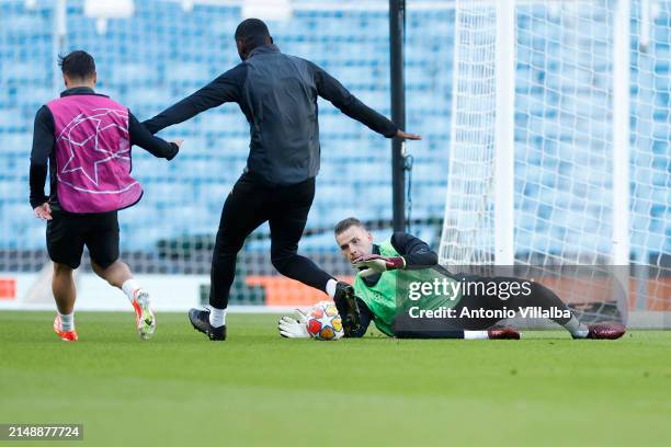 Goalkeeper Andriy Lunin of Real Madrid trains with teammates at Etihad Stadium on April 16, 2024 in Manchester, England.