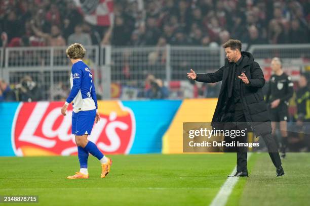 Antoine Griezmann of Atletico Madrid and head coach Diego Simeone of Atletico Madrid discuss and gesture during the UEFA Champions League...