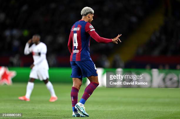 Ronald Araujo of FC Barcelona gestures as he leaves the pitch after being shown a red card by Referee Istvan Kovacs for a foul on Bradley Barcola of...