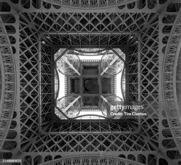 View from underneath the iconic Eiffel Tower, which is a location for the Paris Olympic 2024, with the beach volleyball stadium situated on site on...
