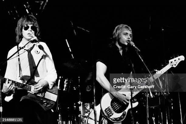 American New Wave musicians Elliot Easton , on guitar, and Benjamin Orr , on bass, both of the group the Cars, perform onstage at the Palladium, New...