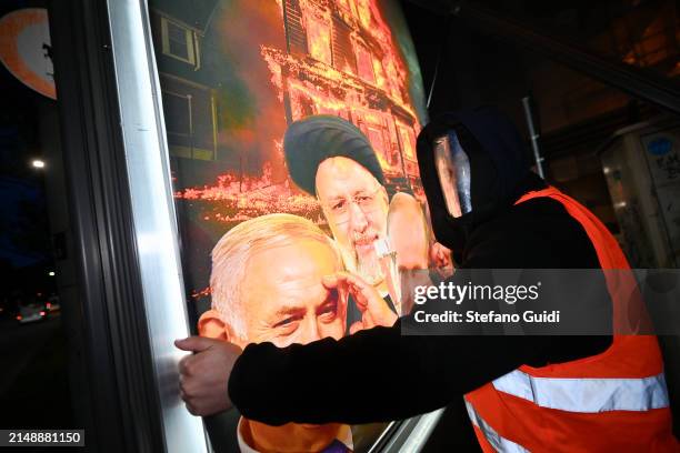 Street Artist Andrea Villa installs an Anti-War Poster, depicting world leaders Benjamin Netanyahu, Prime Minister of Israel, Ebrahim Raisi,...