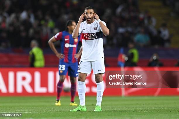 Kylian Mbappe of Paris Saint-Germain gestures after scoring his team's third goal from a penalty kick during the UEFA Champions League quarter-final...