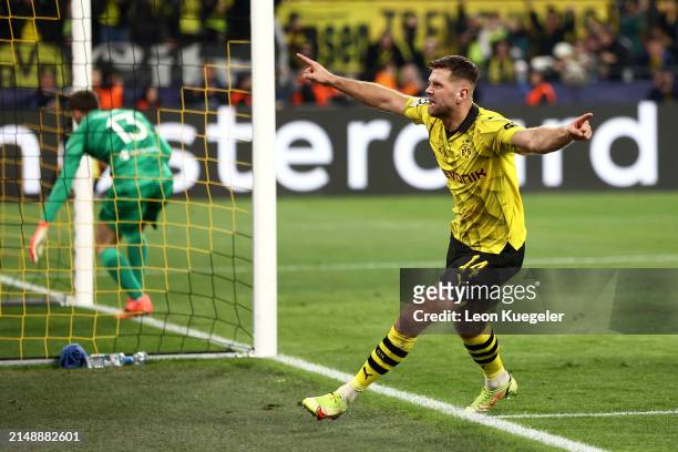 Niclas Fuellkrug of Borussia Dortmund celebrates scoring his team's third goal during the UEFA Champions League quarter-final second leg match...