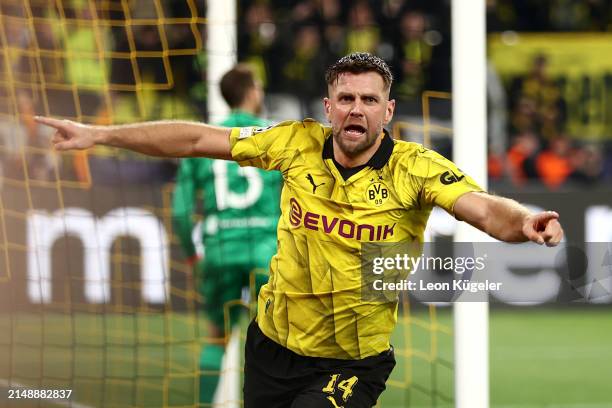 Niclas Fuellkrug of Borussia Dortmund celebrates scoring his team's third goal during the UEFA Champions League quarter-final second leg match...
