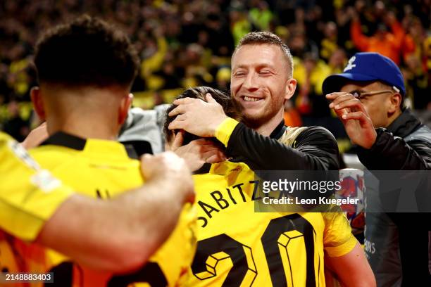 Marcel Sabitzer of Borussia Dortmund celebrates scoring his team's fourth goal with teammate Marco Reus during the UEFA Champions League...