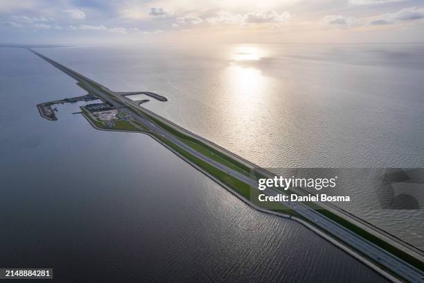aerial view of a flood defense in the netherlands called the afsluitdijk - afsluitdijk stockfoto's en -beelden