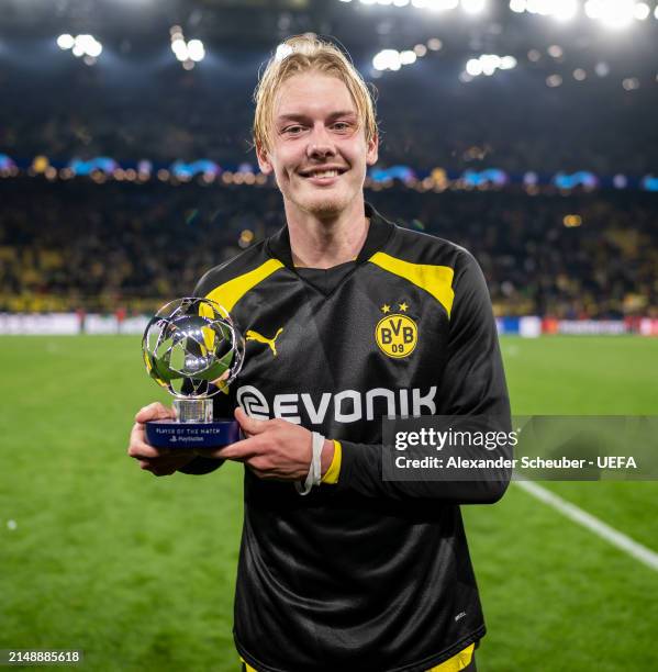 Julian Brandt of Borussia Dortmund poses for a photo with the PlayStation Player Of The Match award during the UEFA Champions League quarter-final...