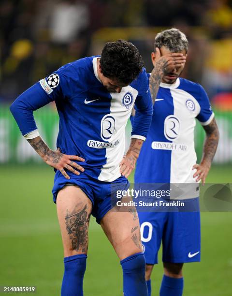 Angel Correa and Jose Gimenez of Atletico Madrid look dejected following the team's defeat during the UEFA Champions League quarter-final second leg...