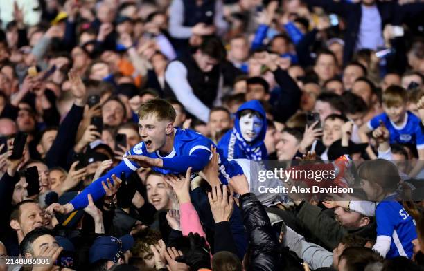 Paddy Lane of Portsmouth crowd surfs as fans invade the pitch after becoming Sky Bet League One champions during the Sky Bet League One match between...