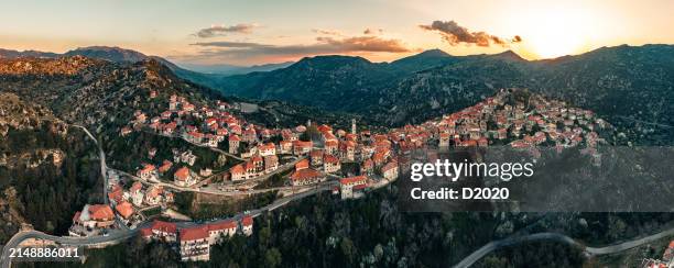 aerial panoramic photo of dimitsana, arcadia, greece at sunset - arcadia greece stock pictures, royalty-free photos & images
