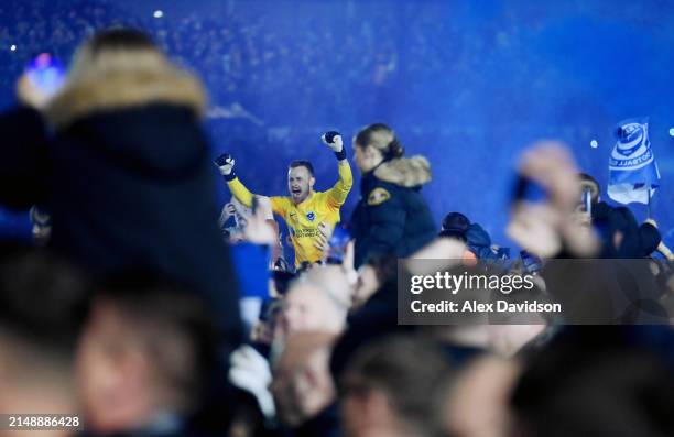 Will Norris of Portsmouth celebrates after becoming Champions of League One during the Sky Bet League One match between Portsmouth and Barnsley at...