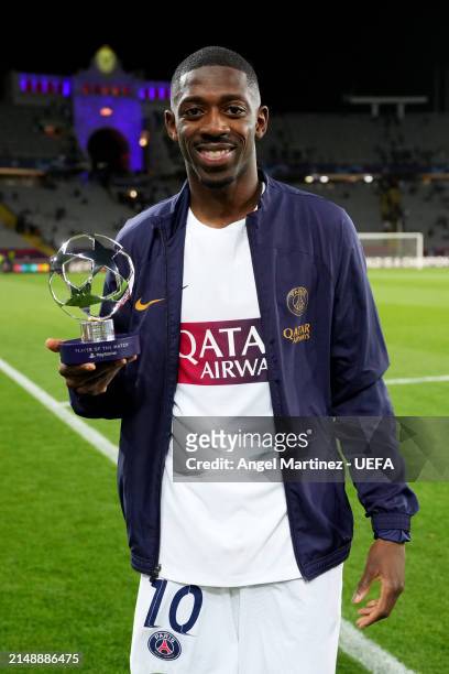 Ousmane Dembele of Paris Saint-Germain poses for a photo with the PlayStation Player Of The Match award after the team's victory in the UEFA...