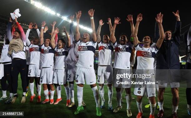 Kylian Mbappe of Paris Saint-Germain celebrates the victory with teammates after the UEFA Champions League quarter-final second leg match between FC...