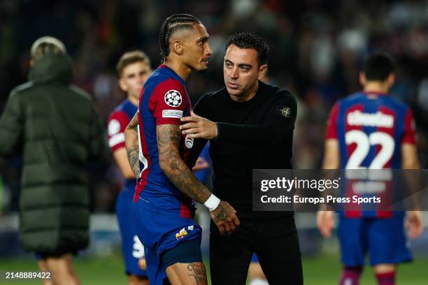 Raphinha and head coach Xavi Hernandez of FC Barcelona greet each other during the UEFA Champions League Quarter-final second-leg match between FC...
