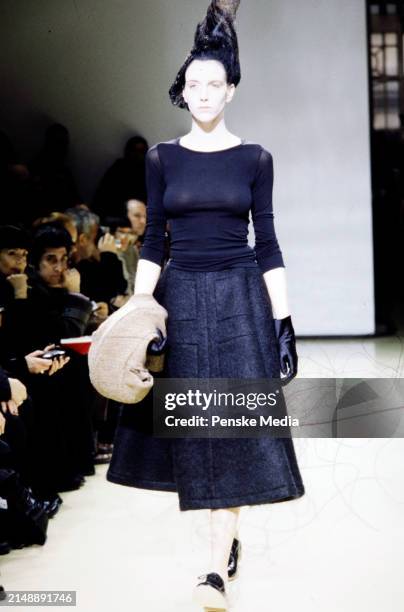 Model Hannelore Knuts walks in the Junya Watanabe Fall 1999 Ready to Wear Runway Show on March 10 in Paris, France.
