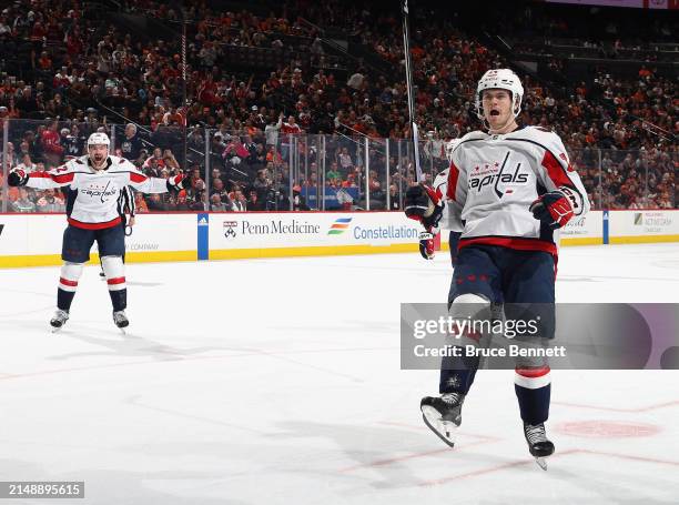 Dylan McIlrath and Connor McMichael of the Washington Capitals celebrate a first period goal by Alex Ovechkin against the Philadelphia Flyers at...