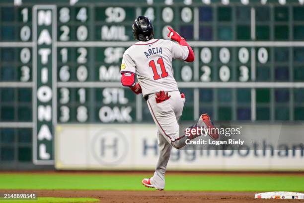 Orlando Arcia of the Atlanta Braves celebrates after hitting a solo home run in the second inning against the Houston Astros at Minute Maid Park on...