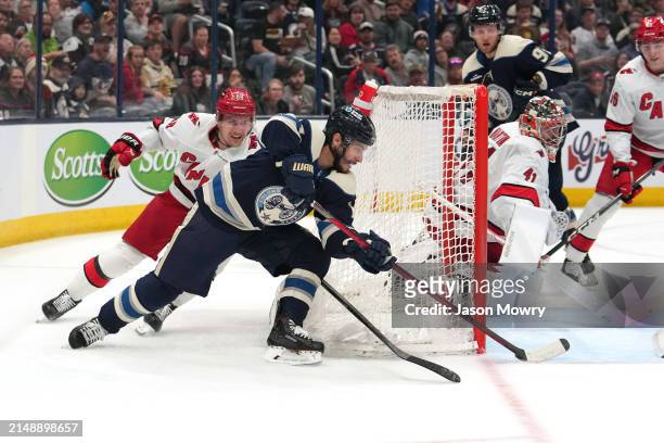 Johnny Gaudreau of the Columbus Blue Jackets scores a goal while Martin Necas of the Carolina Hurricanes defends during the second period a at...