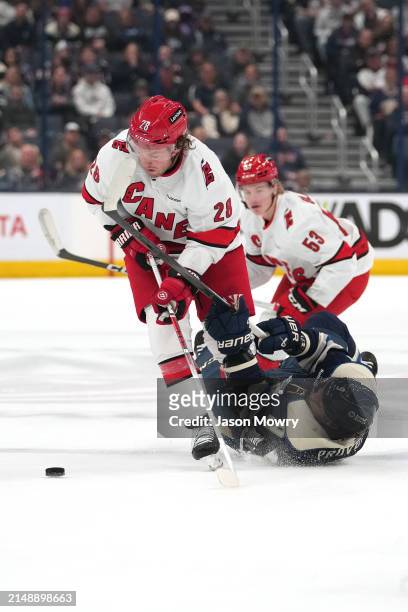 Brendan Lemieux of the Carolina Hurricanes battles Ivan Provorov of the Columbus Blue Jackets for the puck during the second period at Nationwide...