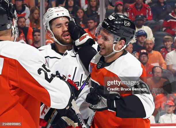 Garnet Hathaway of the Philadelphia Flyers gets the glove up on Tom Wilson of the Washington Capitals during the second period at the Wells Fargo...