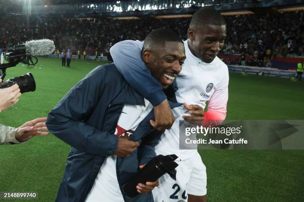 Ousmane Dembele and Nordi Mukiele of PSG celebrate the 4th goal for PSG during the UEFA Champions League quarter-final second leg match between FC...