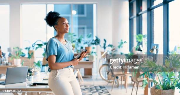 black woman, creative and thinking with tablet at workplace for ambition, career or startup. happy african or female person looking out window with smile and technology in wonder or thought at office - aspirations stock pictures, royalty-free photos & images