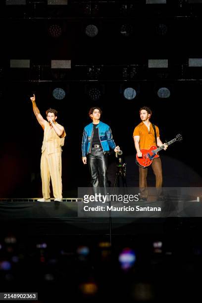 Nick Jonas, Joe Jonas and Kevin Jonas of Jonas Brothers perform live on stage during a concert on April 16, 2024 in Sao Paulo, Brazil.