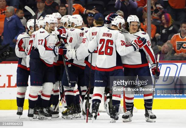 The Washington Capitals celebrate their 2-1 victory over the Philadelphia Flyers at the Wells Fargo Center on April 16, 2024 in Philadelphia,...