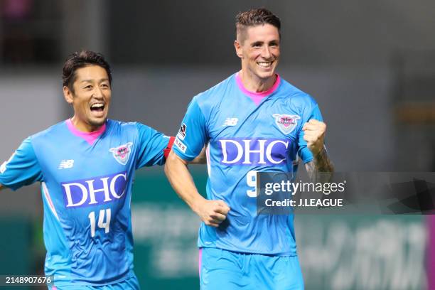 Fernando Torres of Sagan Tosu celebrates with teammate Yoshiki Takahashi after scoring the team's third goal during the J.League J1 match between...