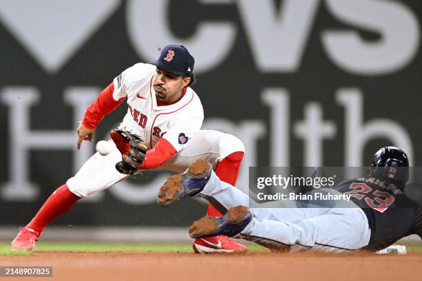 Bo Naylor of the Cleveland Guardians steals second base ahead of the throw to David Hamilton of the Boston Red Sox in the 10th inning at Fenway Park...