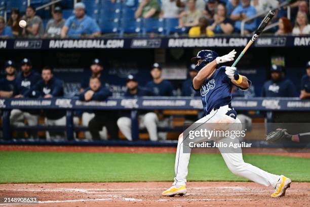 Amed Rosario of the Tampa Bay Rays hits a walk-off RBI single in the 13th inning to defeat the Los Angeles Angels 7-6 at Tropicana Field on April 16,...