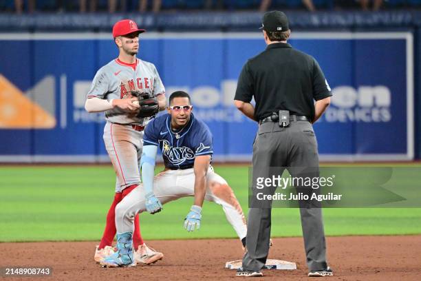 Richie Palacios of the Tampa Bay Rays reacts after hitting an RBI double in the 13th inning against the Los Angeles Angels at Tropicana Field on...