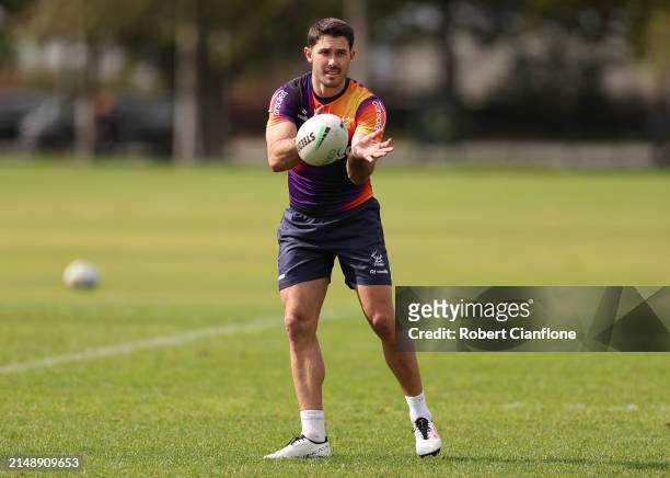Nick Meaney of the Storm passes the ball during a Melbourne Storm NRL training session at Gosch's Paddock on April 17, 2024 in Melbourne, Australia.
